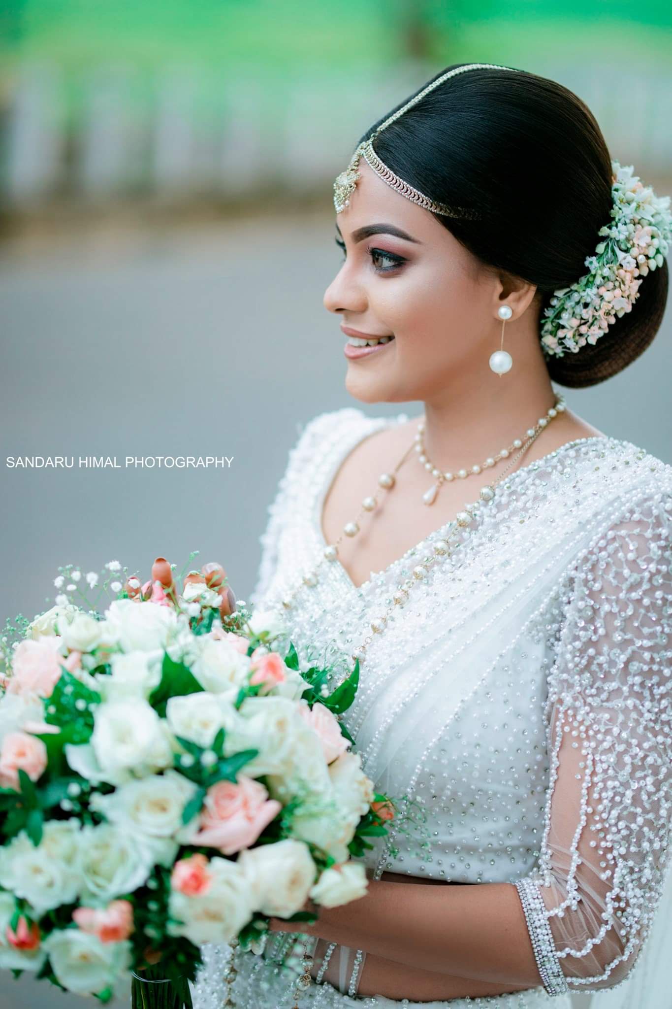 Beautiful model Raveena Rasanjalee elegant stills in White bride saree