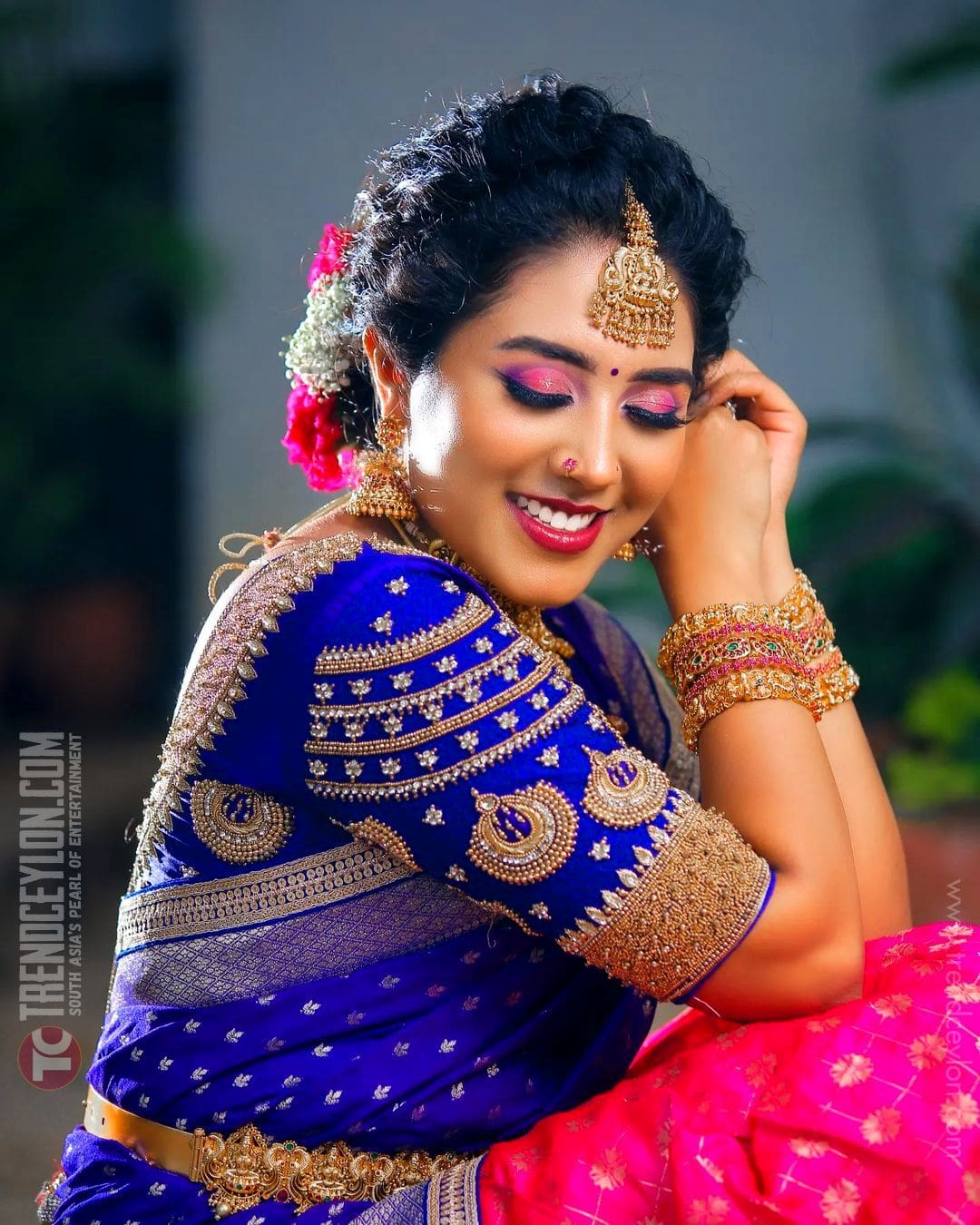 Beautiful actress Sreenithi Photoshoot in Blue half saree